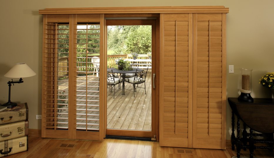 Bypass wood patio door shutters in San Jose living room